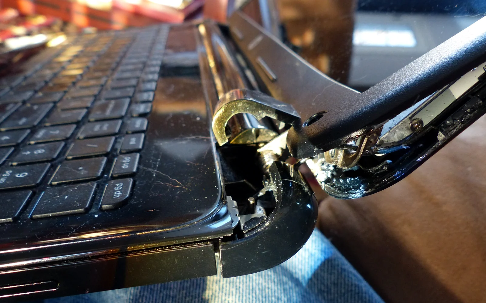 Close-up of a laptop hinge and casing repair